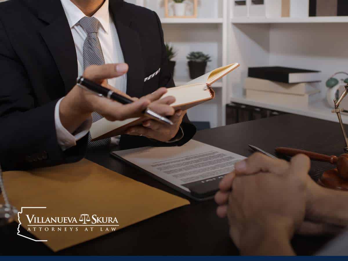 Attorney discussing sexual assault case with a client at a law office