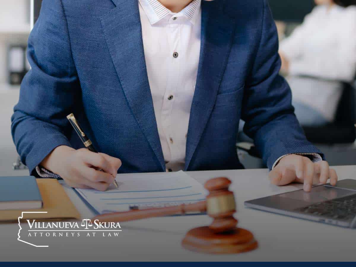 Sex Crime Defense Lawyer in Arizona reviewing case documents with a gavel on the desk
